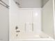 Bathroom featuring a bathtub and shower combination with white surround and chrome fixtures at 106 Grange Dr, Wendell, NC 27591