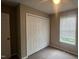 This bedroom features a neutral color scheme, window, closet, ceiling fan, and plush carpet at 106 Grange Dr, Wendell, NC 27591