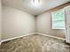 Cozy bedroom with natural light, neutral walls, and closet at 106 Grange Dr, Wendell, NC 27591