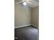 This bedroom features a neutral color scheme, a ceiling fan, wall outlets, and plush carpet at 106 Grange Dr, Wendell, NC 27591