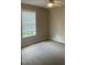 Neutral bedroom with carpet, window, and ceiling fan at 106 Grange Dr, Wendell, NC 27591