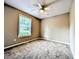 Bedroom featuring neutral walls, plush gray carpet, and a ceiling fan with a light at 106 Grange Dr, Wendell, NC 27591