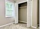 Bedroom featuring an open closet, carpet floors, a window, and neutral-colored walls at 106 Grange Dr, Wendell, NC 27591