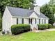 A well-maintained home with manicured bushes adding to the curb appeal of this property at 106 Grange Dr, Wendell, NC 27591