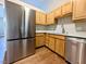 Close-up of the kitchen featuring sleek stainless steel appliances and efficient layout at 106 Grange Dr, Wendell, NC 27591
