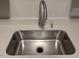 Modern stainless steel sink with updated faucet and fixtures at 106 Grange Dr, Wendell, NC 27591