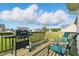 Cozy deck with chairs and a grill, perfect for relaxing and enjoying backyard views in a pleasant setting at 108 Hudson Dr, Princeton, NC 27569