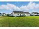 Expansive backyard with lush green grass and a charming single-Gathering home in a peaceful neighborhood at 108 Hudson Dr, Princeton, NC 27569