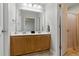 Bathroom with double vanity sinks, tile floors, and ample lighting, perfect for a functional space at 108 Hudson Dr, Princeton, NC 27569