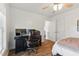Comfortable bedroom area featuring a workspace with monitor and a cozy ceiling fan at 108 Hudson Dr, Princeton, NC 27569
