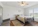 Comfortable bedroom featuring natural light, modern ceiling fan, and a cozy bed at 108 Hudson Dr, Princeton, NC 27569