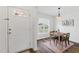 Bright dining room featuring modern decor, a stylish light fixture, and a view to the outside at 108 Hudson Dr, Princeton, NC 27569