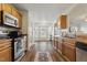 An open concept kitchen showcasing stainless steel appliances and granite countertops at 108 Hudson Dr, Princeton, NC 27569