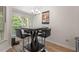 Cozy dining area near windows, perfect for relaxed meals and entertaining guests at 111 Killam Ct # 2A, Cary, NC 27513