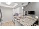 Bright kitchen featuring ample counter space, white cabinetry, and modern lighting at 111 Killam Ct # 2A, Cary, NC 27513