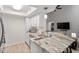 Well-lit kitchen with white cabinets, stainless steel appliances, and marble countertops at 111 Killam Ct # 2A, Cary, NC 27513