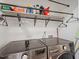 Convenient laundry room with modern washer and dryer, shelving, and ample storage space at 111 Killam Ct # 2A, Cary, NC 27513