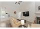 Comfortable living area featuring vaulted ceiling, fireplace, and ample natural light at 111 Killam Ct # 2A, Cary, NC 27513