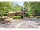 Pool house with manicured bushes and direct access from the parking lot at 111 Killam Ct # 2A, Cary, NC 27513