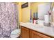 Bright bathroom showcasing vanity, toilet, and shower with decorative curtain at 1220 Canyon Rock Ct # 107, Raleigh, NC 27610