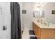 Practical bathroom featuring a shower-tub combo and a double sink vanity at 1220 Canyon Rock Ct # 107, Raleigh, NC 27610
