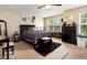 Relaxing bedroom with a large window, cozy bed, and plenty of storage space at 1220 Canyon Rock Ct # 107, Raleigh, NC 27610