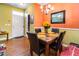 Elegant dining area with a modern chandelier, marble table, and stylish decor at 1220 Canyon Rock Ct # 107, Raleigh, NC 27610