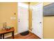 Bright foyer with wood flooring, a coat closet, and a charming entry table at 1220 Canyon Rock Ct # 107, Raleigh, NC 27610