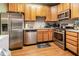 Well-equipped kitchen with stainless steel appliances and ample cabinet space at 1220 Canyon Rock Ct # 107, Raleigh, NC 27610