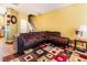 Spacious living room with a large sectional, colorful rug, and open staircase at 1220 Canyon Rock Ct # 107, Raleigh, NC 27610