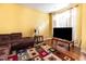 Cozy living room featuring a comfortable sofa, modern rug, and ample natural light at 1220 Canyon Rock Ct # 107, Raleigh, NC 27610
