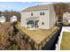 Aerial of a home with a fenced yard, back patio, and view of surrounding neighborhood at 1236 Shadow Shade, Wake Forest, NC 27587