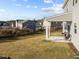 A well-kept backyard with a covered patio, fenced for privacy, and open to the community at 1236 Shadow Shade, Wake Forest, NC 27587