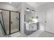 Well-lit bathroom featuring a glass-enclosed shower and double vanity with modern fixtures at 1236 Shadow Shade, Wake Forest, NC 27587
