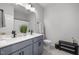 Dual-sink bathroom with elegant vanity, matte black fixtures, and stylish design at 1236 Shadow Shade, Wake Forest, NC 27587