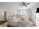 Bright bedroom featuring a queen bed, ceiling fan, and a cozy crib at 1236 Shadow Shade, Wake Forest, NC 27587