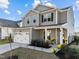 Charming two-story home with a two car garage, well-manicured lawn, and inviting curb appeal at 1236 Shadow Shade, Wake Forest, NC 27587