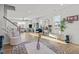 Bright and open-concept living space with hardwood floors, staircase, and an abundance of natural light at 1236 Shadow Shade, Wake Forest, NC 27587