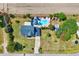 Aerial view of a property showcasing the home, pool, outdoor living spaces, and landscaping at 128 Christy Ln, Dunn, NC 28334
