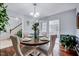 Dining room with wood floors and table with chairs, and natural light at 128 Christy Ln, Dunn, NC 28334