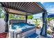 Inviting hot tub on a well-maintained deck with a pergola offering shade and privacy at 128 Christy Ln, Dunn, NC 28334