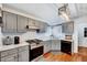 Modern kitchen featuring updated appliances, stylish countertops, and ample cabinet space at 128 Christy Ln, Dunn, NC 28334
