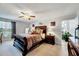 Spacious bedroom featuring a large bed, ceiling fan, and neutral colored walls at 128 Christy Ln, Dunn, NC 28334