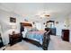 Spacious bedroom featuring a large bed, ceiling fan, and neutral colored walls at 128 Christy Ln, Dunn, NC 28334