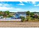 Spacious home featuring a pool, outdoor living area, and lush landscaping at 128 Christy Ln, Dunn, NC 28334