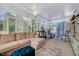 Bright sunroom featuring lots of windows, a ceiling fan, and comfortable seating area at 128 Christy Ln, Dunn, NC 28334