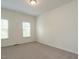 Bedroom with clean carpet and neutral walls features two windows, creating a calm space at 1314 Cornell Pl, Raleigh, NC 27607