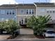Charming townhome exterior with attached garage, balcony, and well-maintained landscaping for a welcoming curb appeal at 1314 Cornell Pl, Raleigh, NC 27607