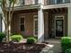 Close-up of a brick townhome entrance showcasing a well-maintained exterior and inviting doorway at 1314 Cornell Pl, Raleigh, NC 27607
