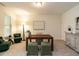 Serene home office featuring a wooden desk, comfortable seating, and soft carpet, ideal for productivity at 1314 Cornell Pl, Raleigh, NC 27607